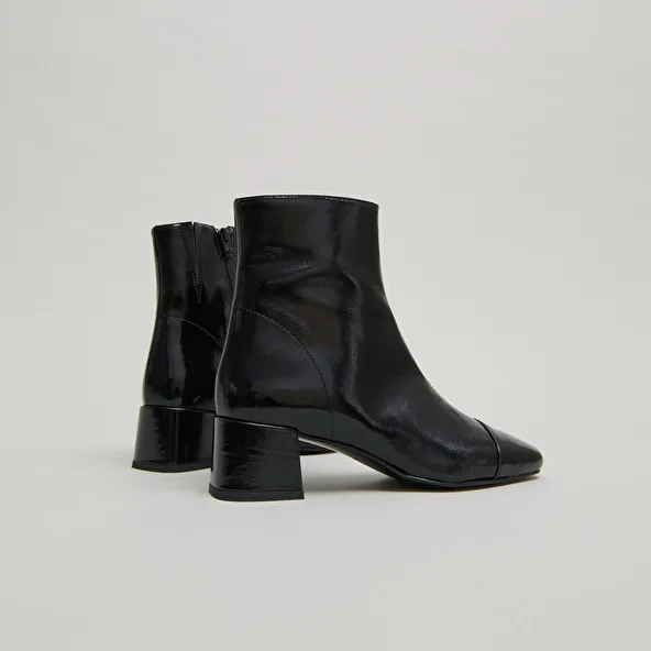 Ankle boots with zips in black pleated patent leather