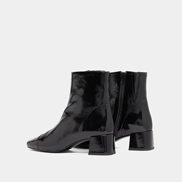 Ankle boots with zips in black pleated patent leather