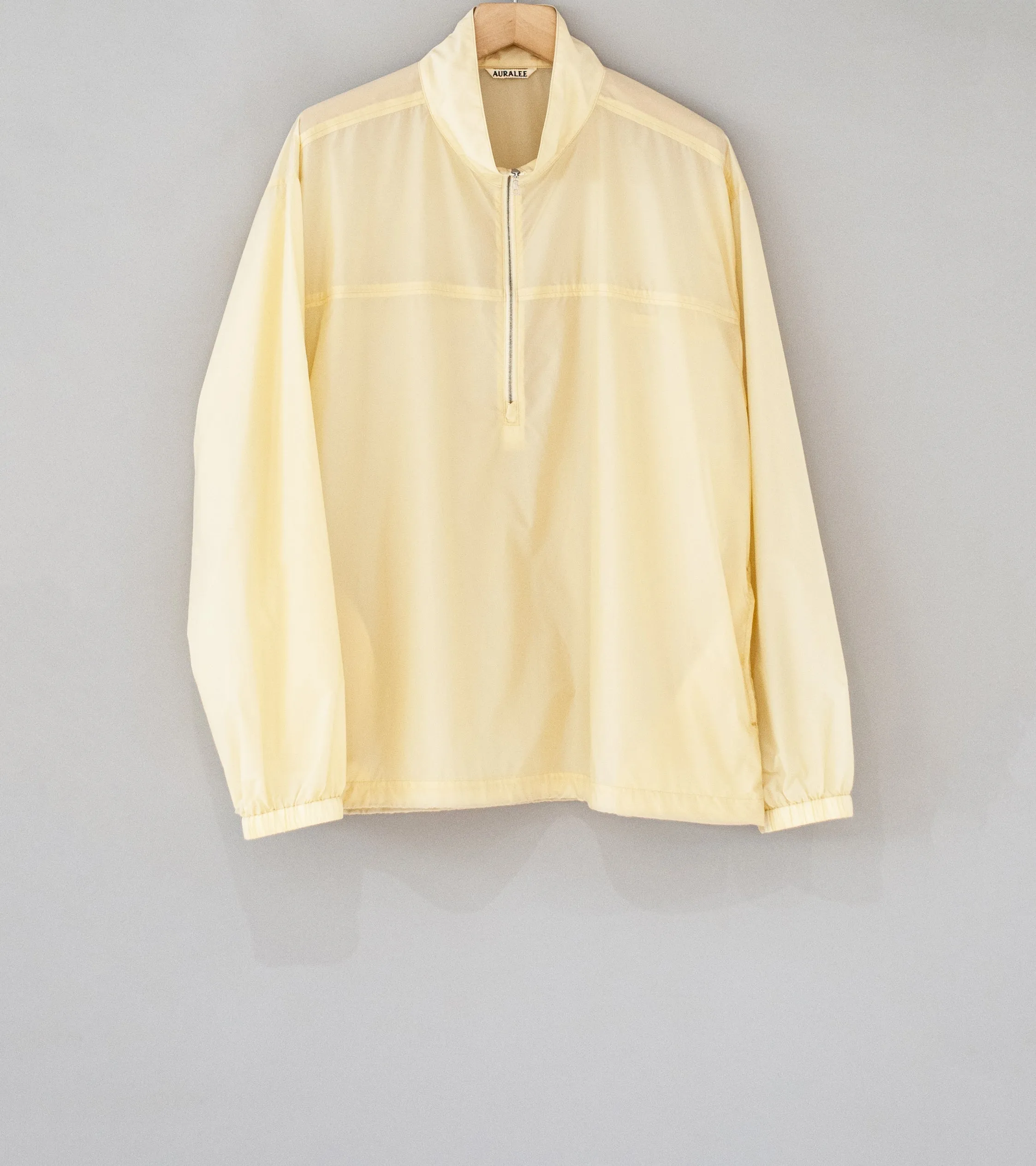 Auralee 'Light Nylon Half Zip P/O' (Light Yellow)