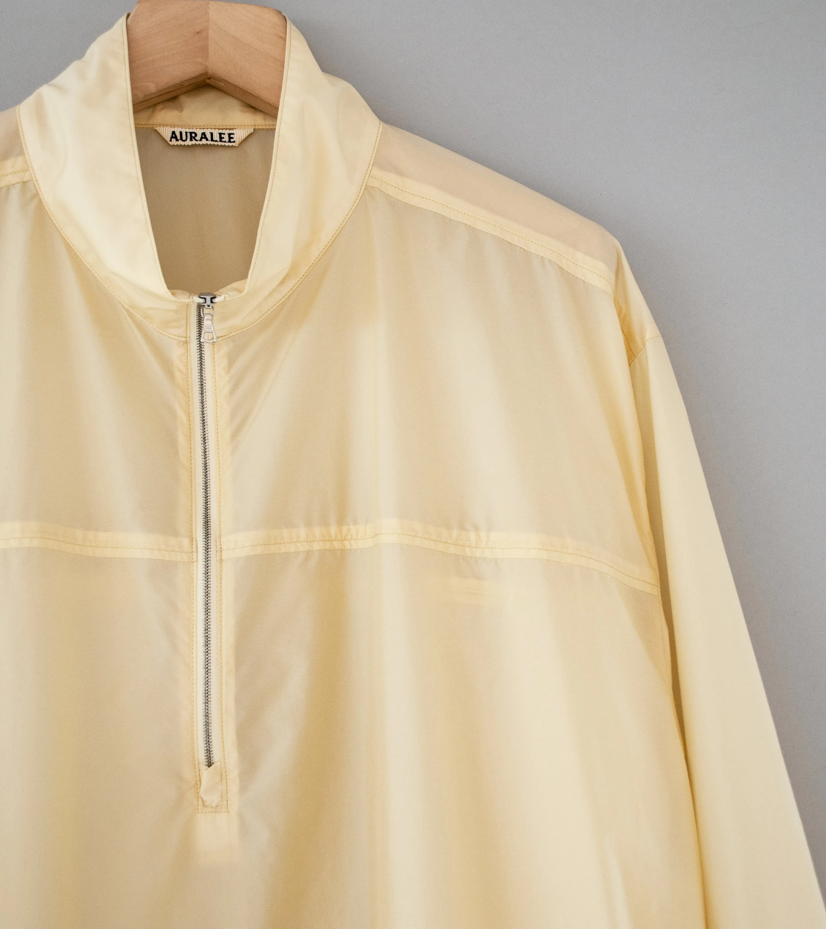 Auralee 'Light Nylon Half Zip P/O' (Light Yellow)