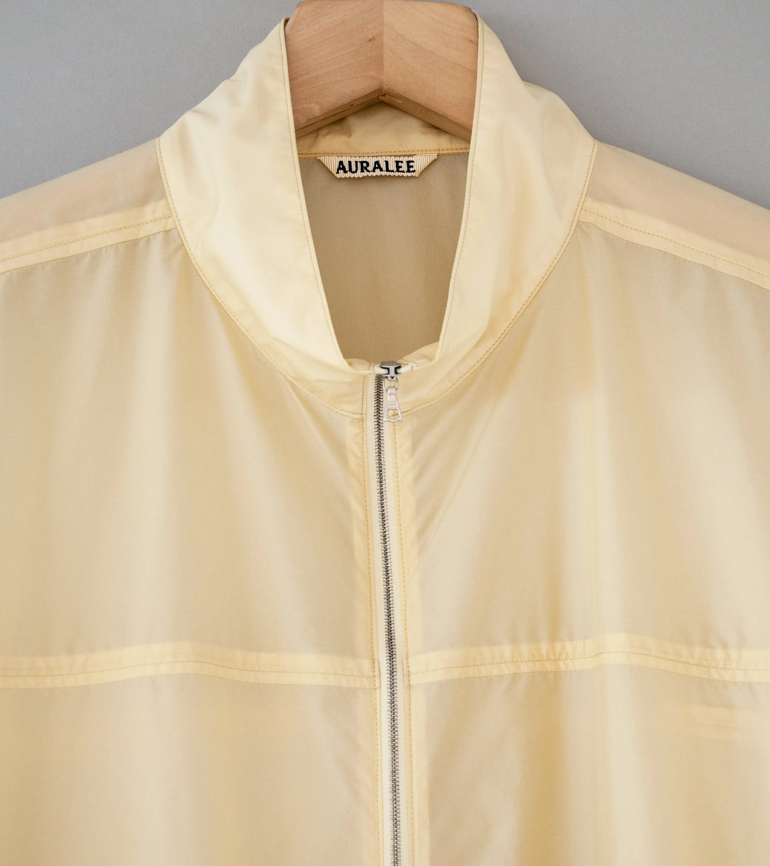 Auralee 'Light Nylon Half Zip P/O' (Light Yellow)